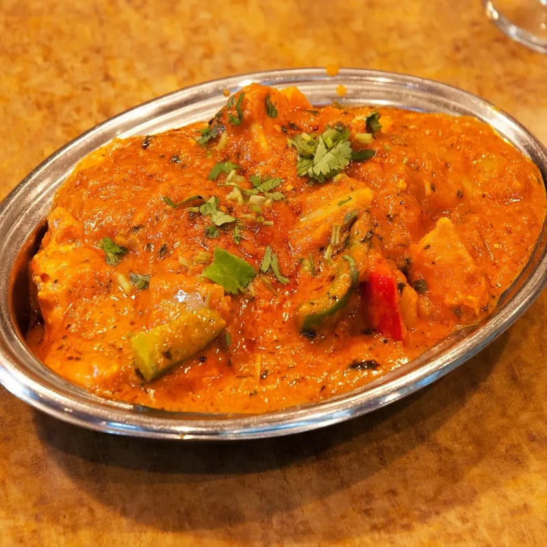 Chicken Tikka Masala at Indian BBQ & Grill Red Deer - Best seller curry with tender chicken in creamy tomato sauce